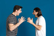 © Drobot Dean - White angry two men gesturing and screaming at each other