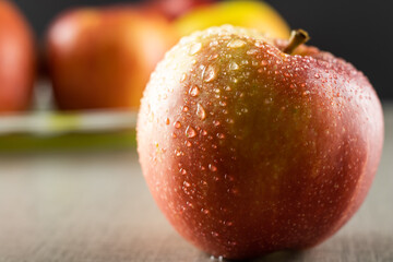 Water drops on a fresh red apple. Close-up.