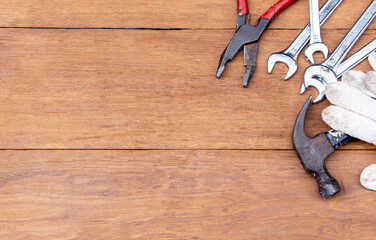 top view of a brown rustic wooden table with tools instruments on it with copy space, background