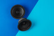 © Oleksii Halutva - Car audio system. A set of speakers on a blue background. Copy space