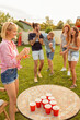 © Impact Photography - Friends playing beer pong at a party