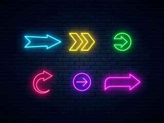 Wall Mural - Neon arrow signs collection. Bright arrow pointer symbols on brick wall background. Set of colorful neon arrows, web icons. Banner design, bright advertising signboard elements. Vector illustration.