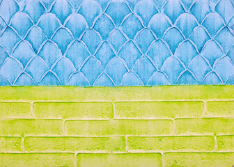 Decorative plaster on the wall, abstract background, imitation of scale and bricks