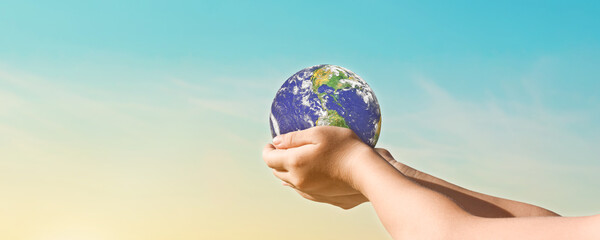 Canvas Print - environment day concept, globe in hands over blue sky background. save of earth. elements of this im