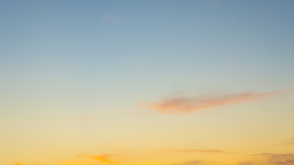 Wall Mural - beautiful sky painted by the sun leaving bright golden shades.dense clouds in twilight sky in winter