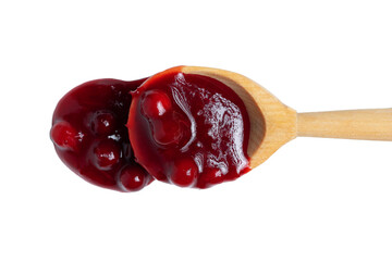 Wall Mural - Homemade sauce made from fresh wild lingonberry drips from a spoon. Isolated on white background, top view