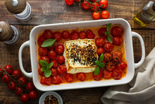 Baked Feta Cheese With Cherry Tomatoes In A Pan