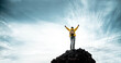Silhouette of male on the mountain with open arms - Successful hiker exult on the top of the rock - Leadership concept