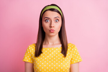 Poster - Portrait of impressed pretty brunette girl blow kiss wear yellow cloth isolated on pastel pink color background