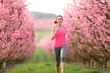 Jogger running in a pink flowers field