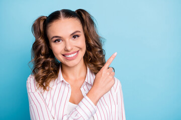 Sticker - Portrait of attractive cheerful brown-haired girl demonstrating copy space new solution isolated over vivid blue color background