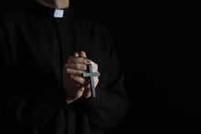 Priest With Cross On Dark Background, Closeup. Space For Text