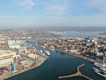 Aerial View Of Poole Harbour And The Historic Quay Area Seen On A Sunny Calm Morning