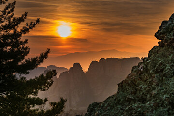 Wall Mural - Red hazy sunset over beautifully shaped rocks/ Incredible unset at Belogradchik rocks, Bulgaria 