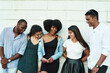 © etonastenka - group of friends laughing over something they looking at smartphone. Young people addiction to new technology trends. Concept of youth, tech, social and friendship