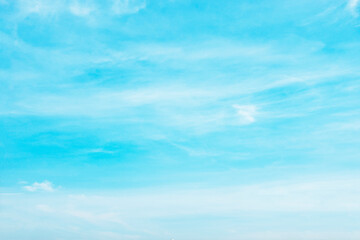 Wall Mural - Blue sky background and white clouds soft focus, and copy space horizontal shape