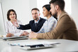 © chagin - Businessman explains to colleagues a new project in the office