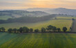 © robertharding - Aerial vista of rolling farmland in summer time, Devon, England, United Kingdom