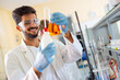 © NDABCREATIVITY - Young scientist student man working at the laboratory