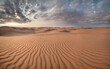 © robertharding - Sand dunes at sunset in the Wahiba Sands desert with clouds in the sky, Oman, Middle East