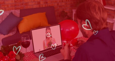 Sticker - Heart icons over caucasian man showing a ring while having a video call on laptop