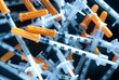 canvas print picture - Pile of syringes for insulin on a black background, macro photo
