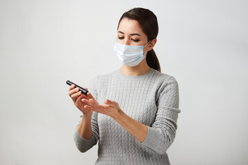 Poster - Young woman testing her blood sugar level, close-up