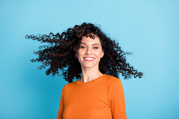 Sticker - Portrait of attractive dreamy cheerful girl having fun wind blowing hair isolated over bright blue color background