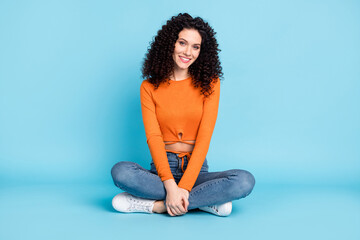 Sticker - Full body photo of young attractive girl happy positive smile sit floor isolated over blue color background