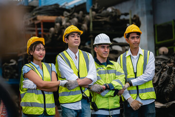 Team engineering, worker standing at warehouse auto parts. industry factory car automobile. Teamwork technician shaking hands work successful, connection partnership successful concept.