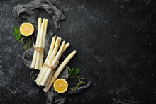 Organic Food. White Asparagus On A Black Background. Healthy Food. Top View. Free Space For Your Text.