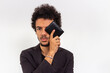 © Vinicios Ferreira - Black man with black t-shirt and blazer on white background with black wallet