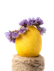 Wall Mural - Сreative photo with easter yellow egg and flower wreath.