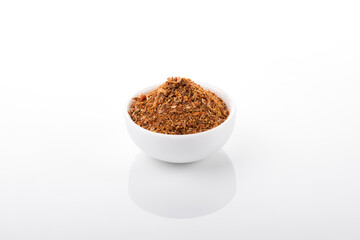 Wall Mural - Ras el hanout moroccan spice. Ras el hanout in white bowl, on white background. Moroccan spice