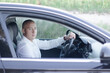 © OliaVesna - handsome bald man in a suit in a luxury car. businessman in automobile