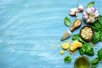 Wall Mural - Food background with fresh ingredients for making basil pesto .