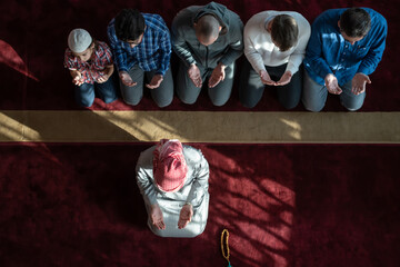 Wall Mural - group of muslim people praying namaz in mosque.