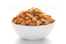 Close up of Crunchy masala peanuts Indian namkeen (snacks) on a ceramic white bowl