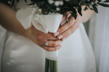 Sticker - Bride wearing a wedding ring and holding her bouquet of flowers