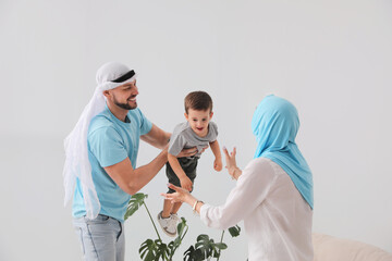 Happy Muslim family spending time together at home