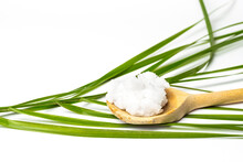 Unrefined Coconut Oil On A White Background With Wooden Spoon