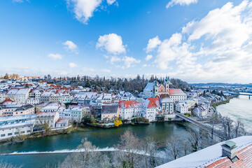 Wall Mural - city of steyr, panoramic view from castle schloss lamberg on a snowy day in april