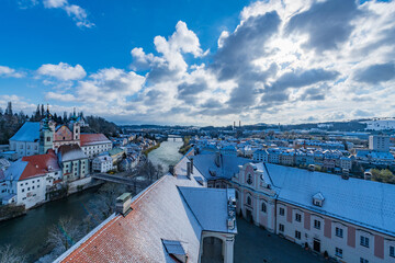 Wall Mural - city of steyr, panoramic view from castle schloss lamberg on a snowy day in april
