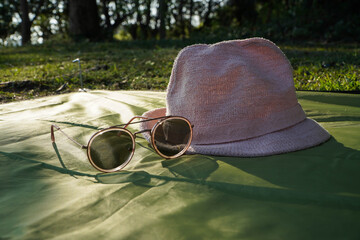 Sunglasses with a hat and natural sunlight
