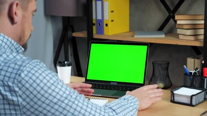 Green screen mock up chroma key display monitor laptop computer concept: Businessman at home office tells listen company top manager employee online conference webcam video call business meeting chat