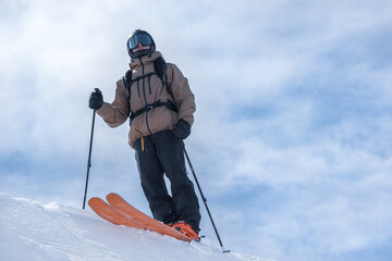 Wall Mural - Young man skiing in the Pyrenees at the Grandvalira ski resort in Andorra in Covid19 time.