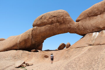 a hole in a mountain near spitzkoppe in namibia