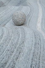 Beautiful View Of Grey Stone Ball And Curved Wall Texture Background Made By Water And River. Spa And Wellness Concept.