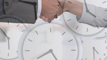 Sticker - Animation of clocks moving fast over businessman and businesswoman shaking hands