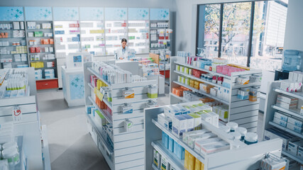 Wall Mural - Big Modern Pharmacy Drugstore with Shelves full of Packages Full of Modern Medicine, Drugs, Vitamin Boxes, Pills, Supplements, Health Care Products. Pharmacist Standing at Counter.